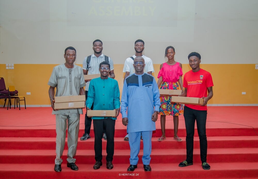Group photo with Dr. Twumasi Ankrah and laptop recipients