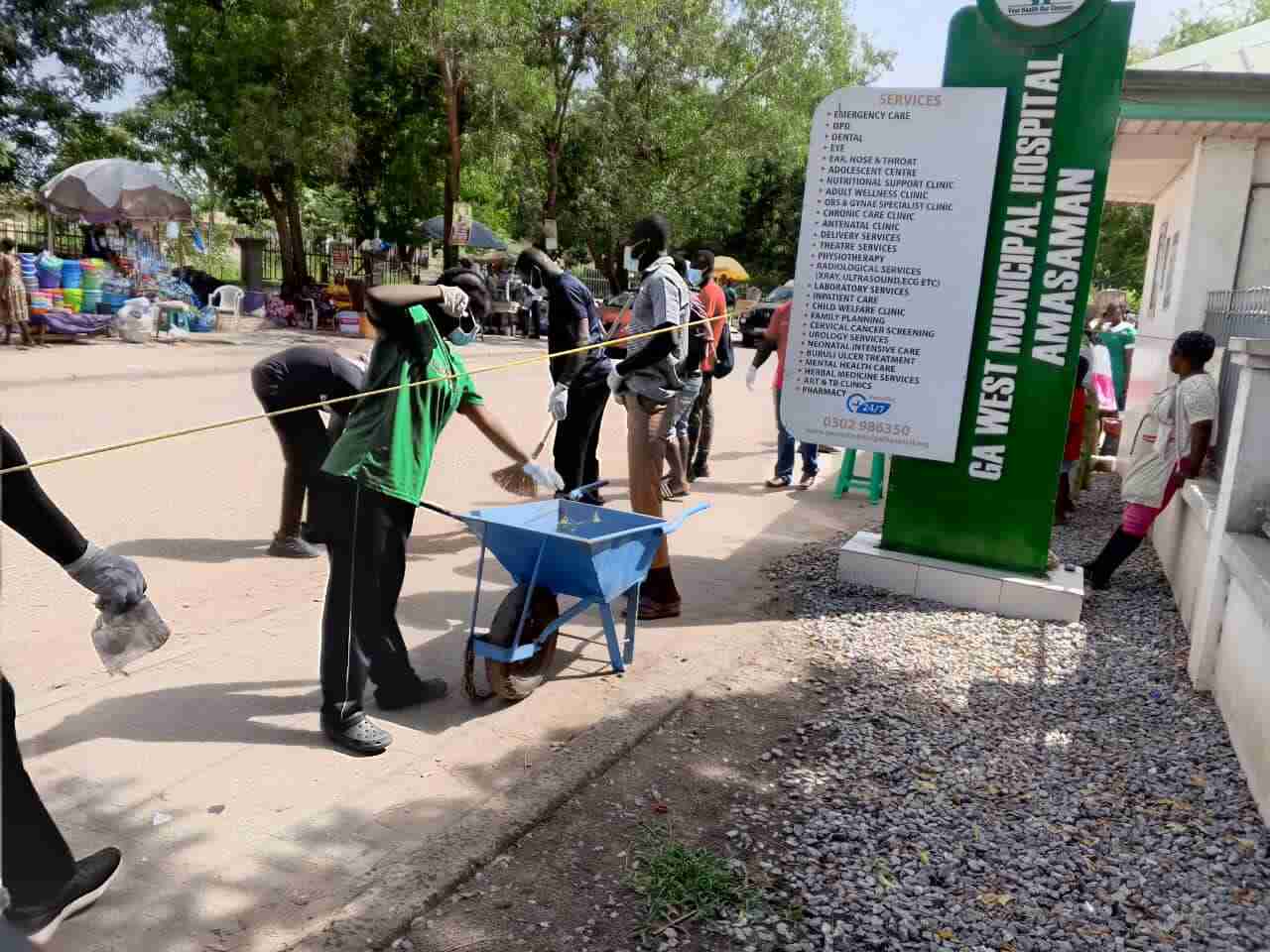 Faculty and students working together to clear debris