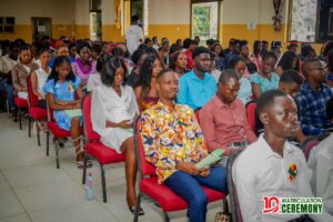 Newly admitted students listening intently during matriculation address