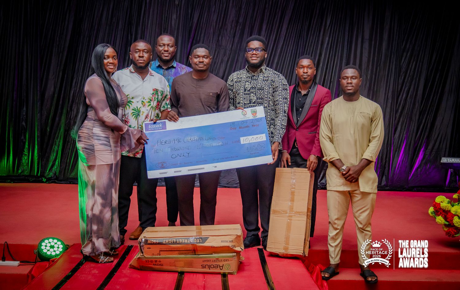 Representative handing over GHS 10,000 cheque to SRC