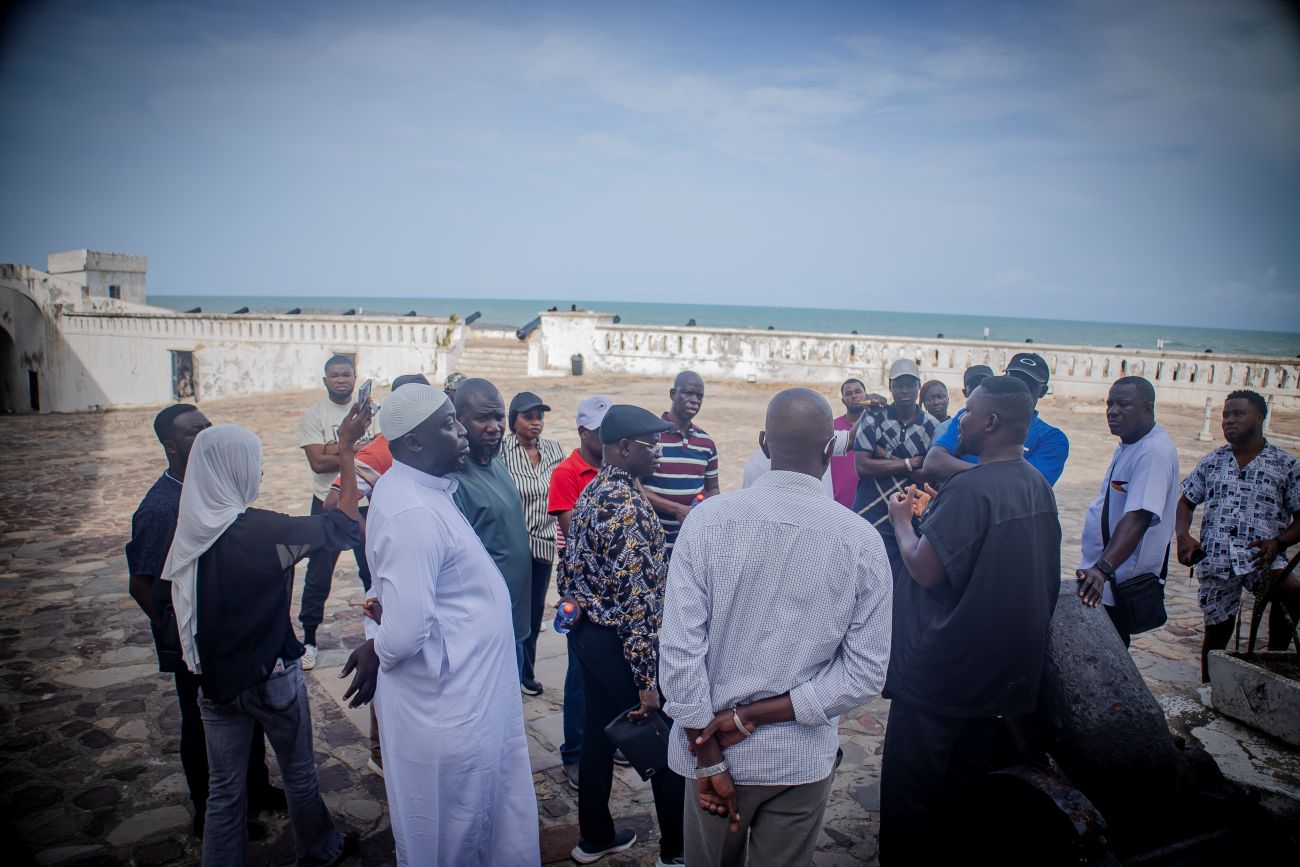 Gambian lawmakers listening to history of slave trade at castle